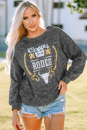 Mineral Washed COW'S FIRST RODEO Round Neck Raglan Sleeve Sweatshirt