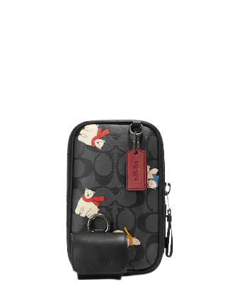 coach-multifunction-phone-pack-in-signature-canvas-with-polar-bear-print.png