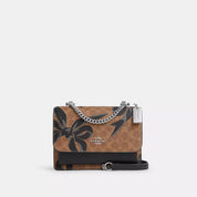 Coach Outlet Klare Crossbody Bag In Signature Canvas With Bow Print